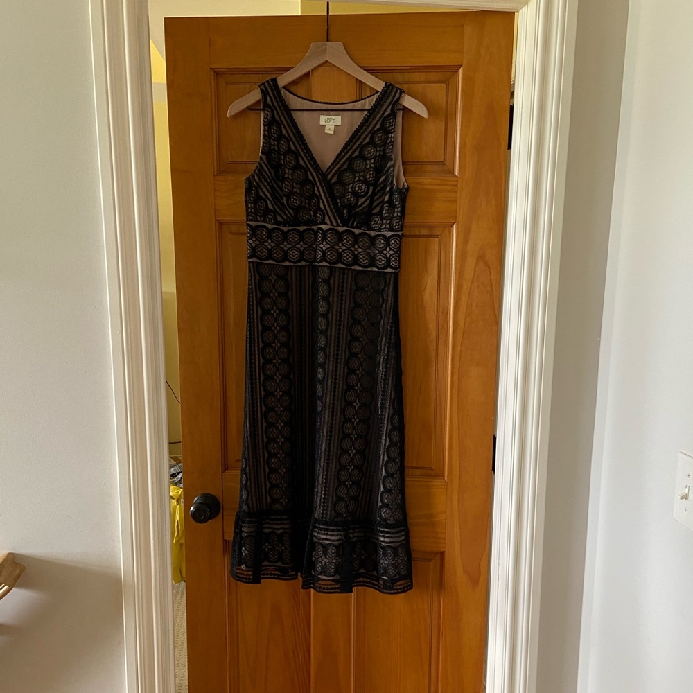 Loft black lace with tan liner.